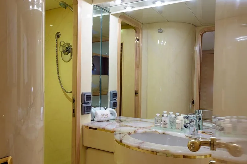  Yacht Photos Pics Luxurious yacht bathroom with marble sink, elegant fixtures, and toiletries, Cantieri Navali Nicolini 43, 1995.