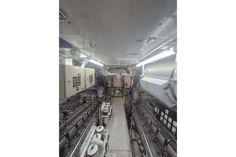  Yacht Photos Pics Engine room of 1995 Cantieri Navali Nicolini 43 yacht, featuring machinery and control panels.