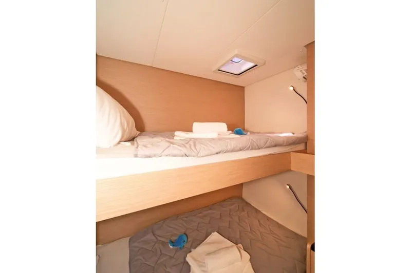 First Life Yacht Photos Pics 2025 Fountaine Pajot Tanna 47 cabin with cozy bunk beds and modern lighting.