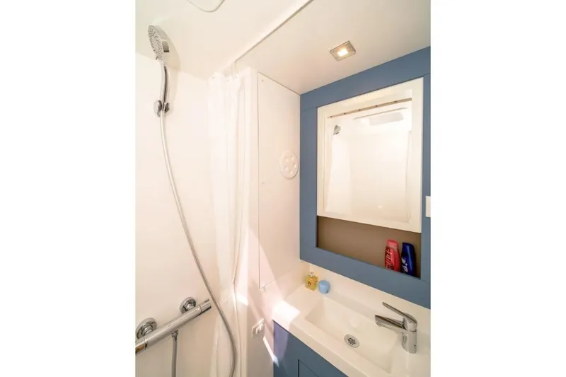 First Life Yacht Photos Pics Modern bathroom in 2025 Fountaine Pajot Tanna 47 yacht, featuring shower and sink.