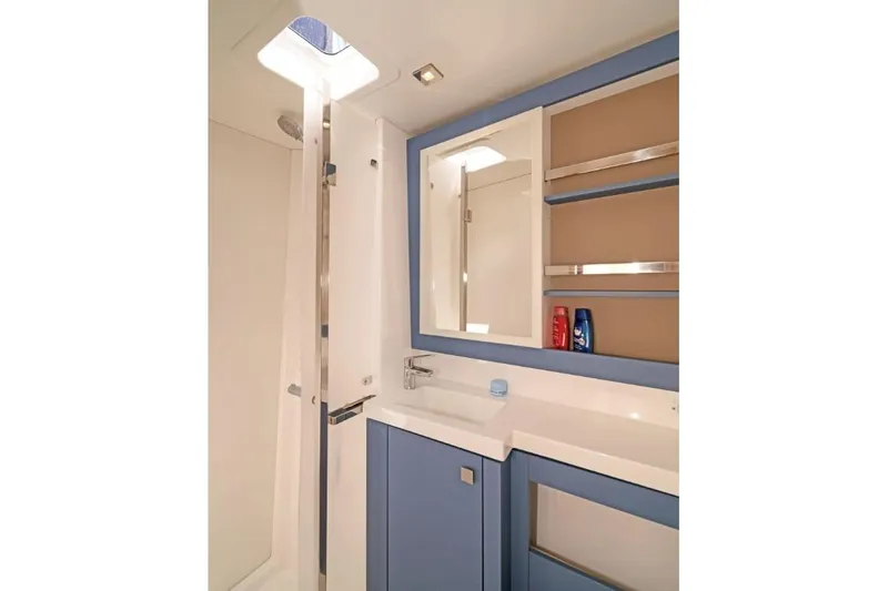 First Life Yacht Photos Pics Modern bathroom interior of 2025 Fountaine Pajot Tanna 47 yacht, featuring sleek design.