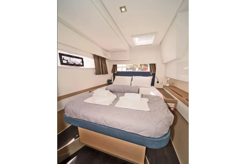 First Life Yacht Photos Pics Luxurious cabin interior of 2025 Fountaine Pajot Tanna 47 yacht with cozy bedding.