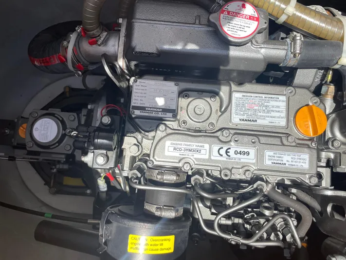 Seabatical Yacht Photos Pics Engine of a 2016 Lagoon 380 catamaran, showcasing detailed mechanical components.