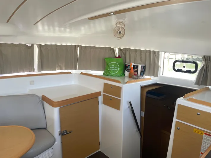 Seabatical Yacht Photos Pics Interior of 2016 Lagoon 380 catamaran with seating, storage, and natural light.
