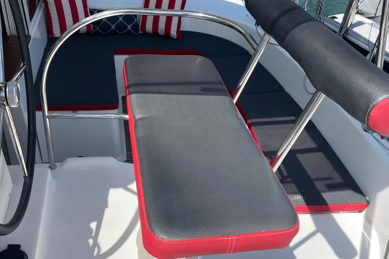 Seabatical Yacht Photos Pics Cockpit seating on 2016 Lagoon 380 catamaran with red and gray cushions.