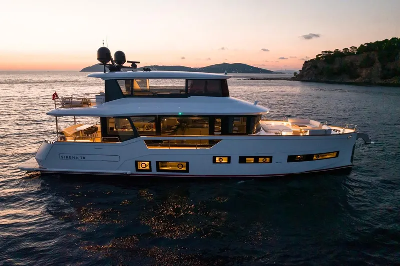  Yacht Photos Pics Luxurious Sirena 78 yacht cruising at sunset, 2027 model, elegant design and modern features.