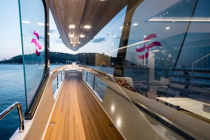  Yacht Photos Pics Luxurious Sirena 78 yacht deck with sleek design, reflecting serene waters, 2027 model.