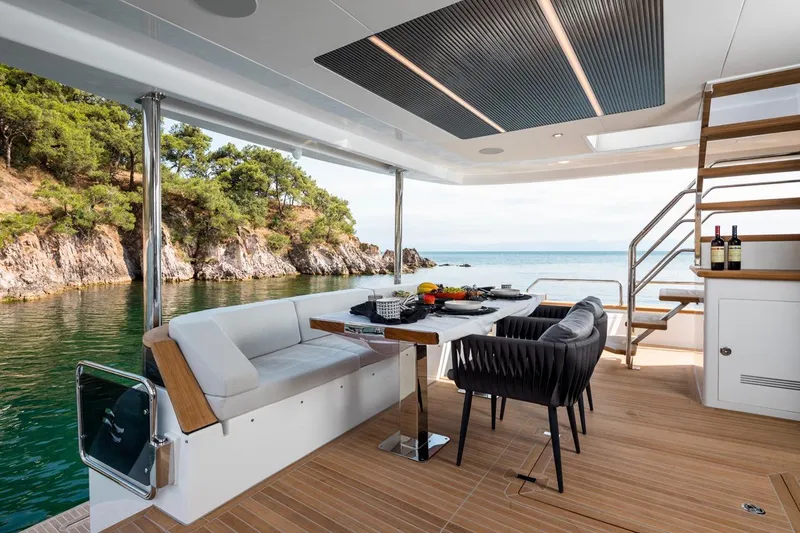  Yacht Photos Pics Luxurious Sirena 78 yacht deck with dining area, scenic ocean view, and modern design, 2027 model.