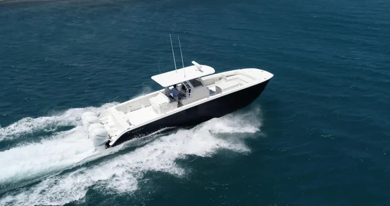 Warevel Yacht Photos Pics 2019 Invincible 40 Catamaran cruising on open water, showcasing sleek design and powerful performance.