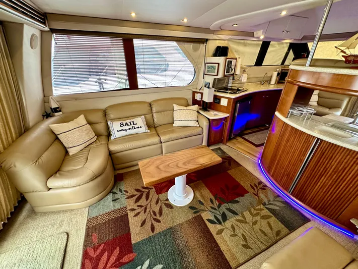 Journey Yacht Photos Pics Luxurious interior of a 1999 Carver 450 Pilothouse yacht with cozy seating and modern amenities.
