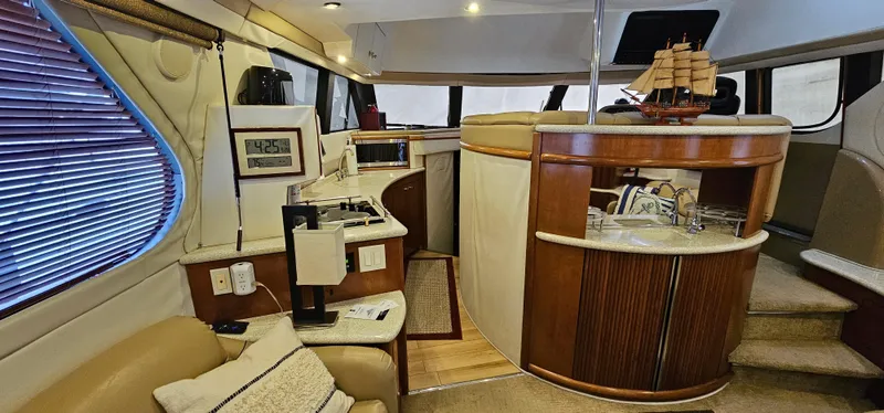 Journey Yacht Photos Pics 1999 Carver 450 Pilothouse interior with modern amenities and elegant design.