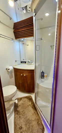 Journey Yacht Photos Pics 1999 Carver 450 Pilothouse bathroom with shower, sink, and toilet.