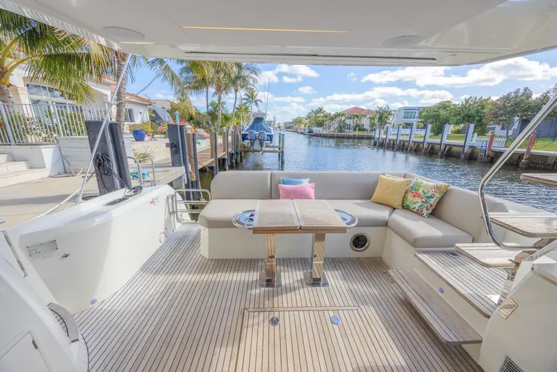 Happy Cay Yacht Photos Pics Luxurious 2021 Prestige 520 Flybridge yacht with spacious deck and canal view.