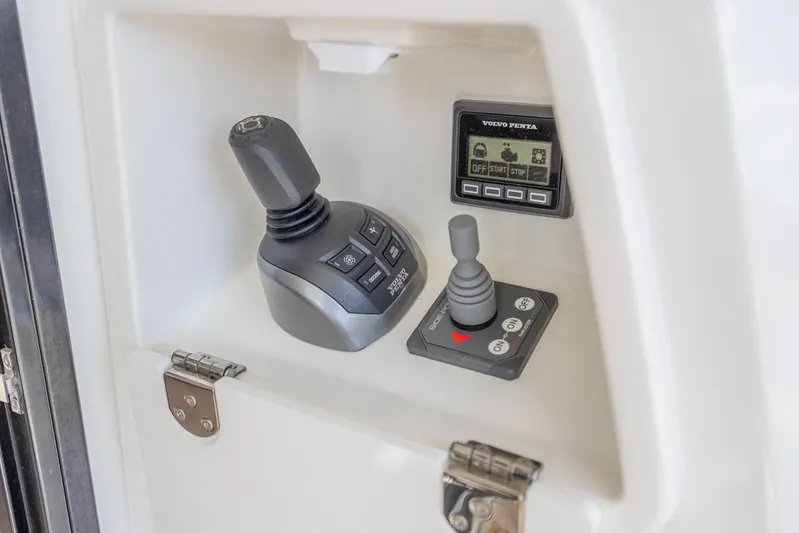 Happy Cay Yacht Photos Pics Control panel of 2021 Prestige 520 Flybridge yacht with joystick and display.