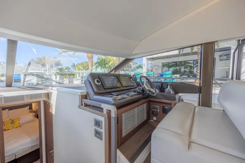 Happy Cay Yacht Photos Pics Interior helm of 2021 Prestige 520 Flybridge yacht with modern navigation equipment.