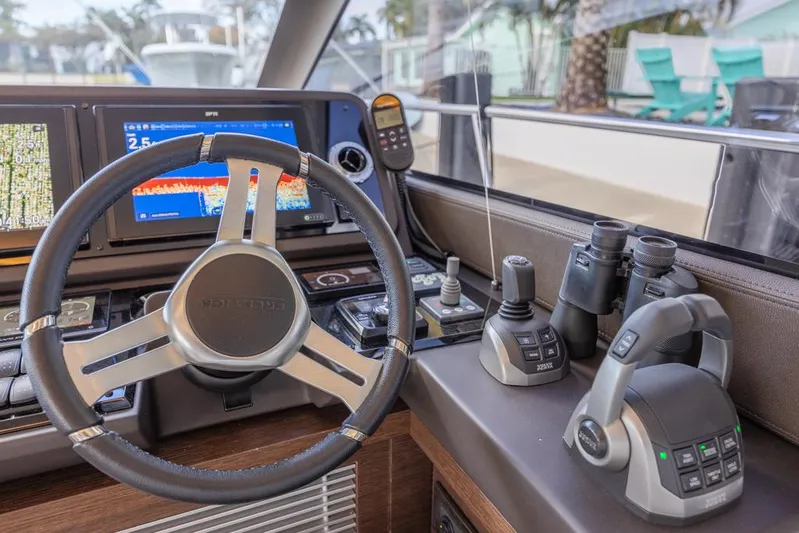 Happy Cay Yacht Photos Pics Prestige 520 Flybridge 2021 yacht helm with advanced navigation controls and displays.