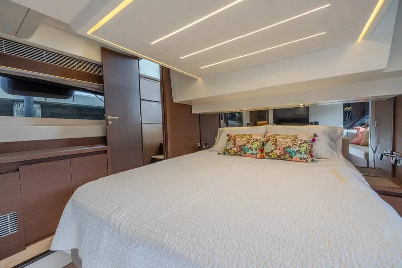 Happy Cay Yacht Photos Pics Luxurious bedroom interior of 2021 Prestige 520 Flybridge yacht with modern design.
