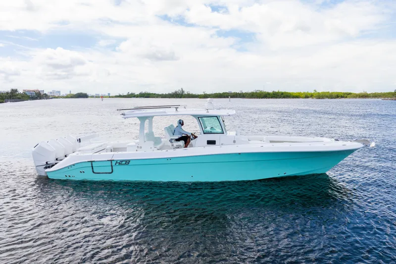  Yacht Photos Pics 2026 HCB 42 Lujo boat on water, featuring sleek design and multiple engines.