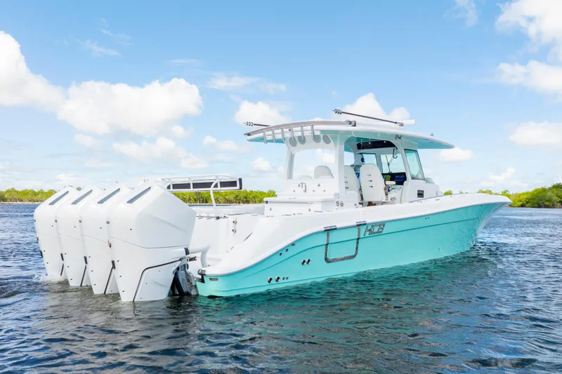  Yacht Photos Pics 2026 HCB 42 Lujo boat with four engines on a sunny day.