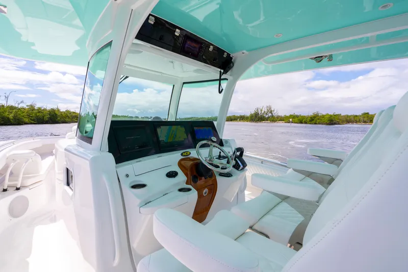  Yacht Photos Pics Interior view of 2026 HCB 42 Lujo boat with modern helm and seating.