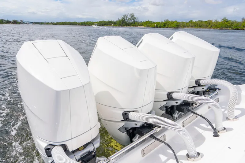 Yacht Photos Pics Four powerful outboard engines on a 2026 HCB 42 Lujo boat cruising on water.