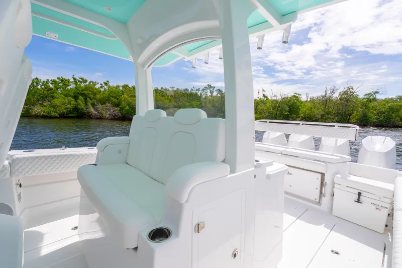  Yacht Photos Pics Luxurious interior of 2026 HCB 42 Lujo boat with white seating and scenic water view.