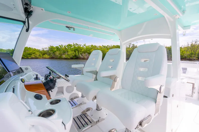  Yacht Photos Pics Interior of 2026 HCB 42 Lujo boat with luxurious white seating and modern controls.