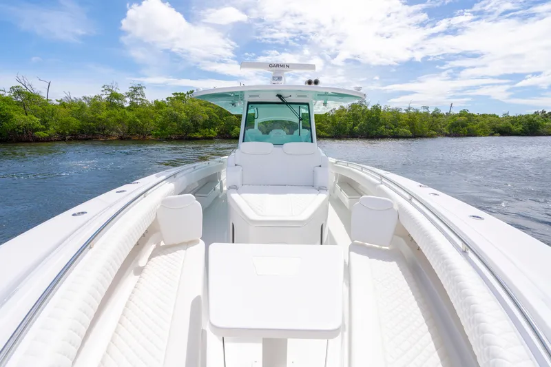  Yacht Photos Pics 2026 HCB 42 Lujo boat with luxurious seating on a serene waterway.