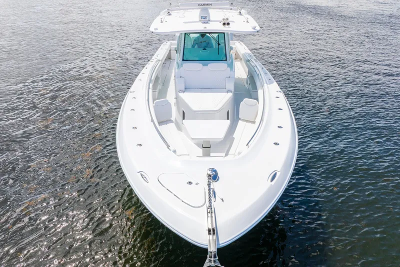  Yacht Photos Pics 2026 HCB 42 Lujo boat on water, showcasing sleek design and spacious deck.