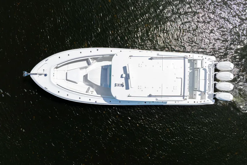  Yacht Photos Pics Aerial view of 2026 HCB 42 Lujo boat on water, showcasing sleek design and powerful engines.