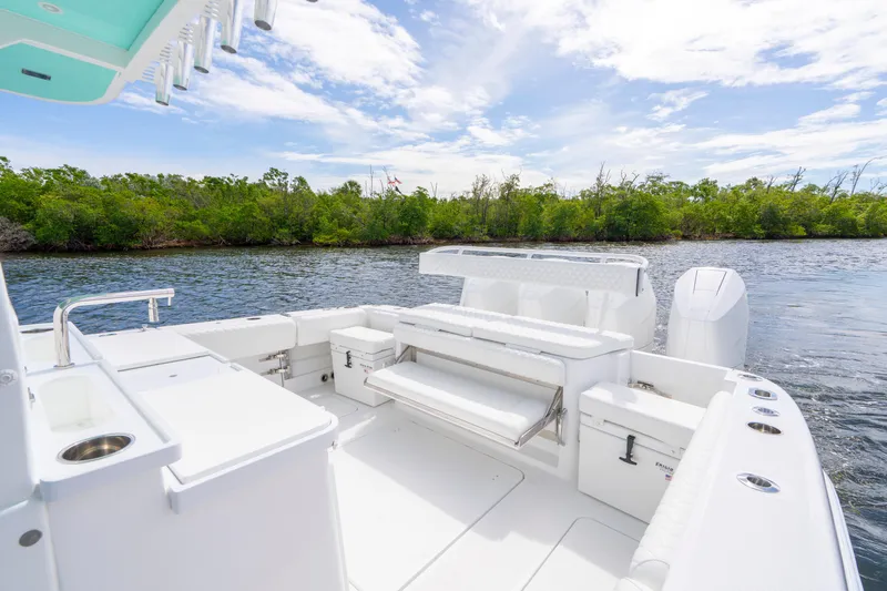  Yacht Photos Pics 2026 HCB 42 Lujo boat interior with seating, on a scenic waterway.