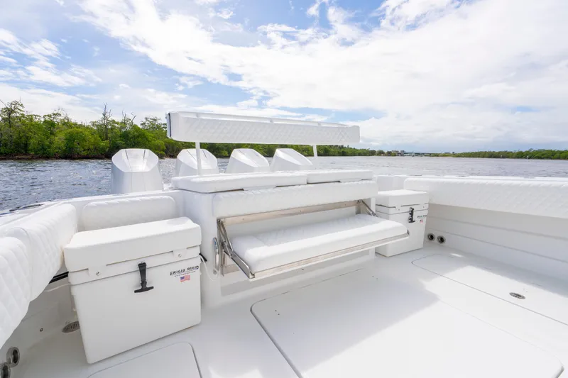  Yacht Photos Pics Luxurious 2026 HCB 42 Lujo boat interior with white seating and scenic water view.