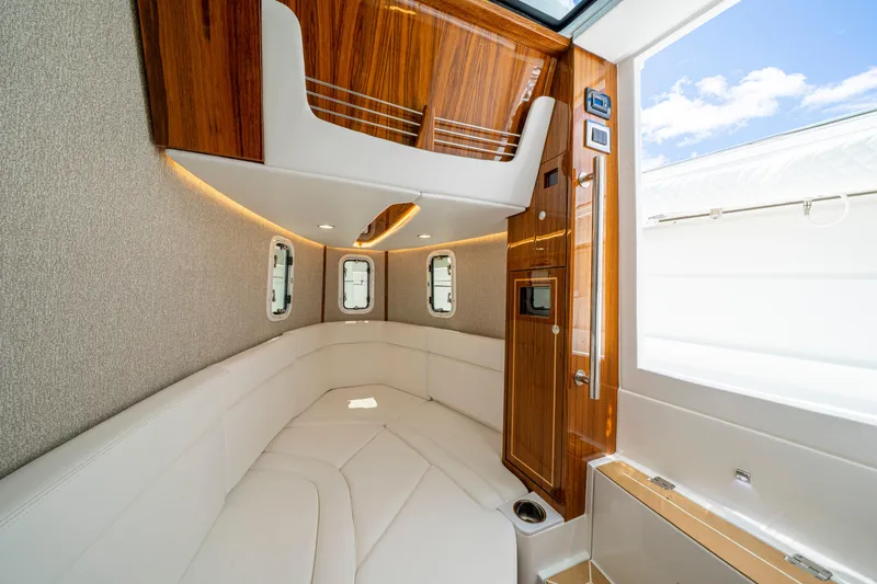  Yacht Photos Pics Luxurious interior of 2026 HCB 42 Lujo yacht with elegant wood and leather finishes.