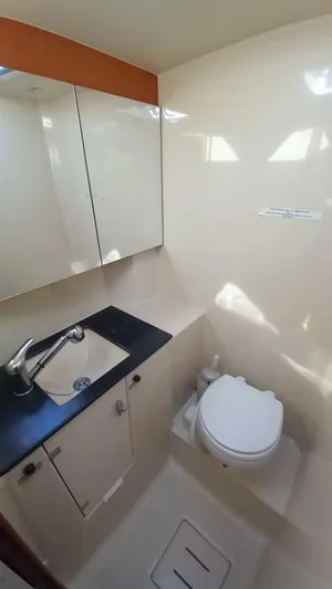 Refit Totale Anno 2023/2024 Yacht Photos Pics Bathroom interior of 2007 Dufour 525 Grand Large yacht, featuring sink and toilet.