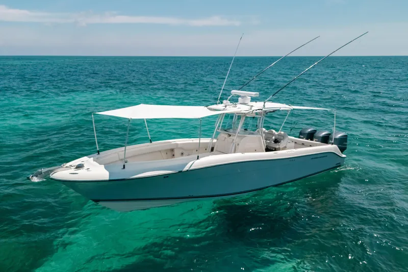  Yacht Photos Pics 2008 Hydra-Sports Vector 3300 CC boat on clear turquoise ocean water.