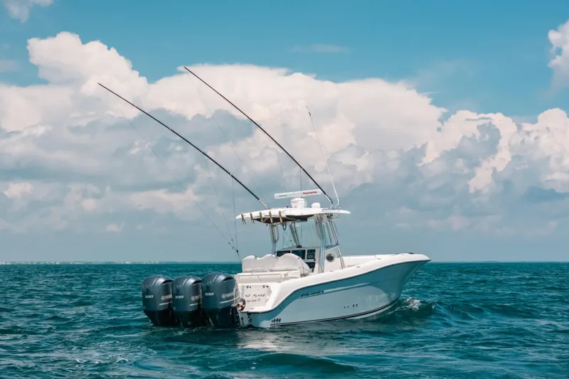  Yacht Photos Pics 2008 Hydra-Sports Vector 3300 CC boat on open ocean under cloudy sky.