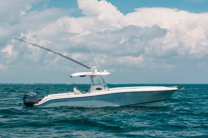  Yacht Photos Pics 2008 Hydra-Sports Vector 3300 CC boat on open sea under cloudy sky.