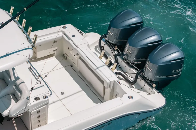  Yacht Photos Pics 2008 Hydra-Sports Vector 3300 CC boat with triple Yamaha outboard engines on turquoise water.