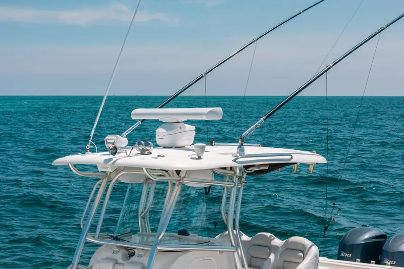  Yacht Photos Pics 2008 Hydra-Sports Vector 3300 CC boat with fishing rods on open sea.