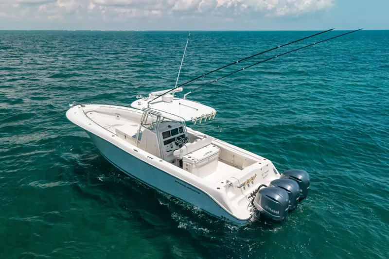  Yacht Photos Pics 2008 Hydra-Sports Vector 3300 CC boat on open ocean with triple Yamaha engines.