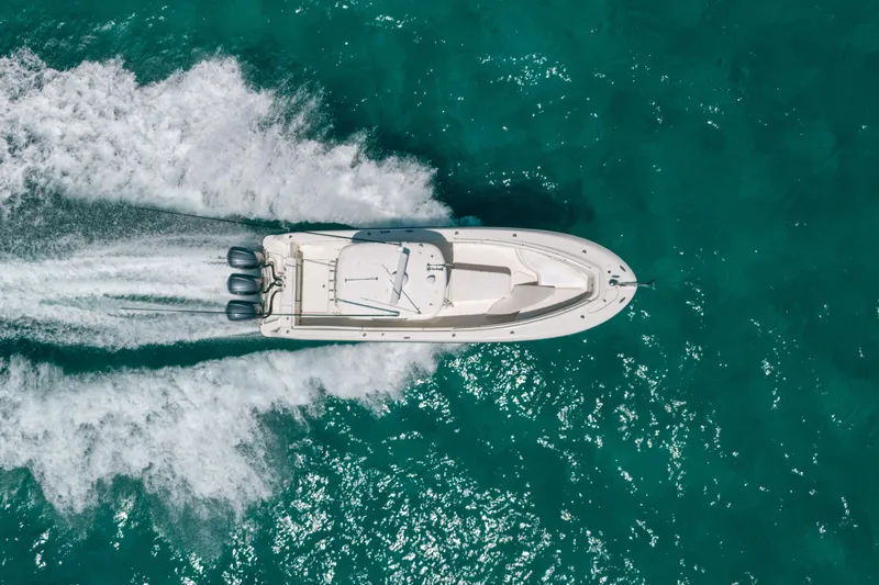  Yacht Photos Pics Aerial view of 2008 Hydra-Sports Vector 3300 CC speeding on turquoise water.