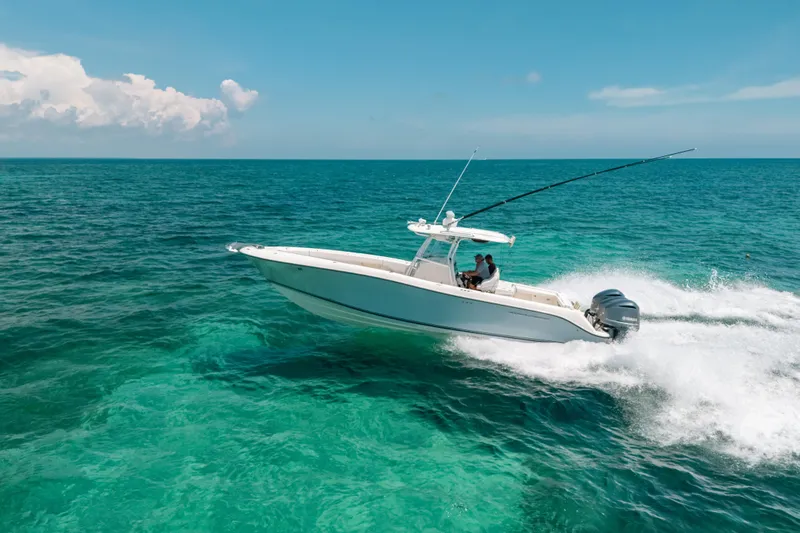  Yacht Photos Pics 2008 Hydra-Sports Vector 3300 CC cruising on clear blue ocean waters.