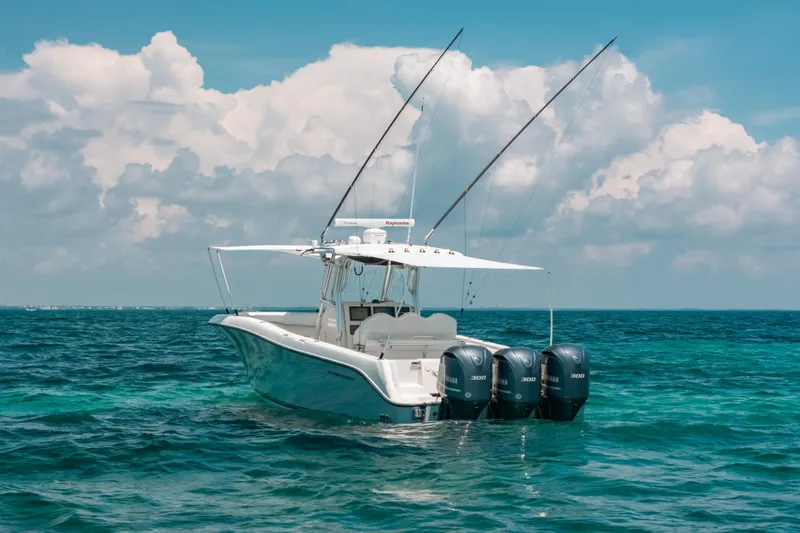  Yacht Photos Pics 2008 Hydra-Sports Vector 3300 CC boat on ocean with triple Yamaha engines.