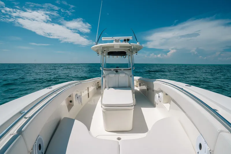  Yacht Photos Pics 2008 Hydra-Sports Vector 3300 CC boat on open sea under clear blue sky.