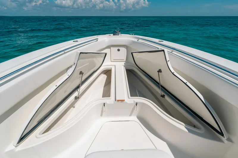  Yacht Photos Pics 2008 Hydra-Sports Vector 3300 CC boat with open storage compartments on the ocean.