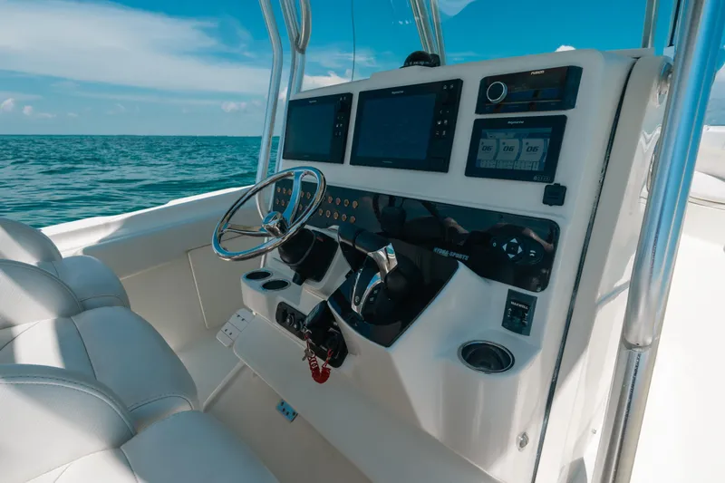  Yacht Photos Pics 2008 Hydra-Sports Vector 3300 CC boat dashboard with steering wheel and navigation screens.
