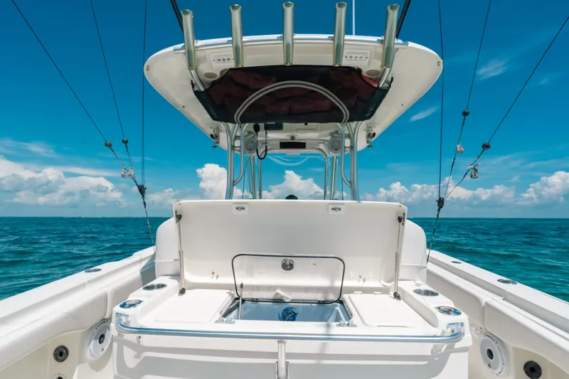  Yacht Photos Pics 2008 Hydra-Sports Vector 3300 CC boat on open ocean under clear blue sky.