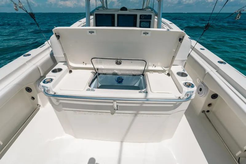  Yacht Photos Pics 2008 Hydra-Sports Vector 3300 CC boat with open storage compartment on deck.