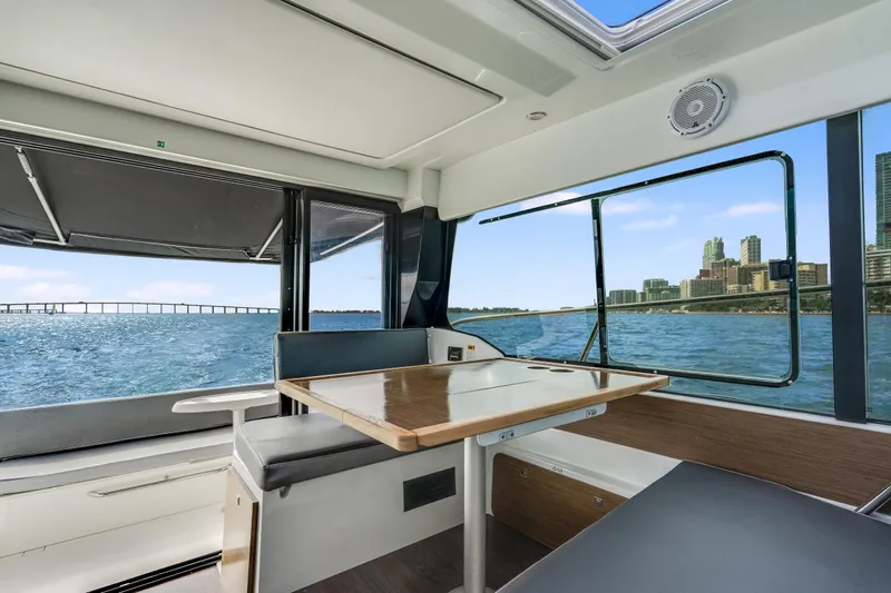  Yacht Photos Pics Interior of 2019 Jeanneau NC 1095 boat with city skyline view.