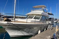 1991 Trader 47 yacht docked at marina under clear blue sky.
